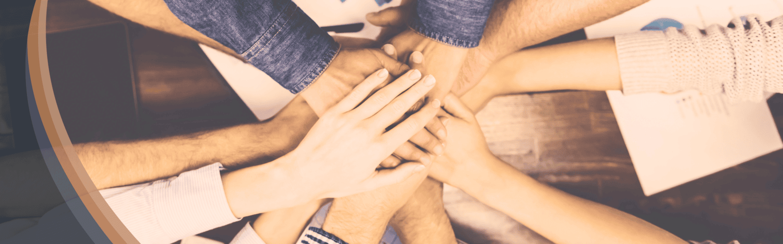 Multiple hands stacked together in the center of a group in Optimum Transitions brand colors, symbolizing collaborative ESOP advisory services including exits and succession planning, mergers and acquisitions, partial ESOP strategies, and implementation support